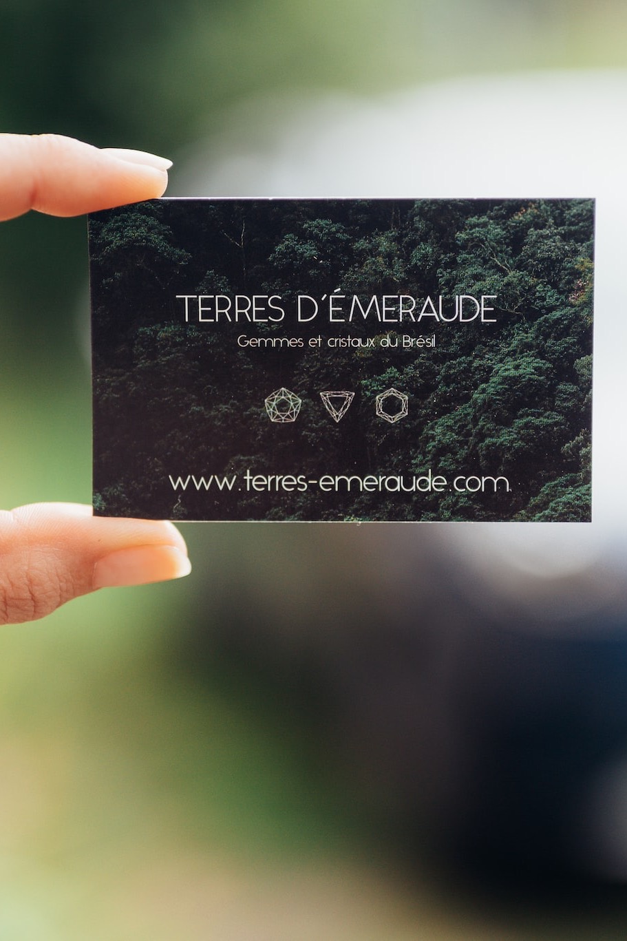 person holding black and white card